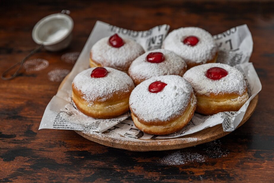 Tasty donuts with jam – Hanukkah celebration concept